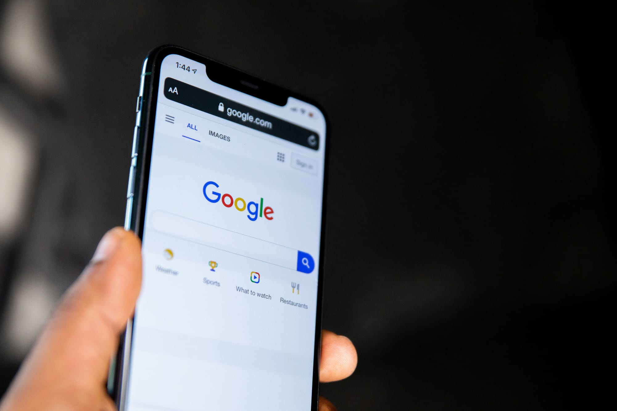 mobile phone with Google search on the screen
